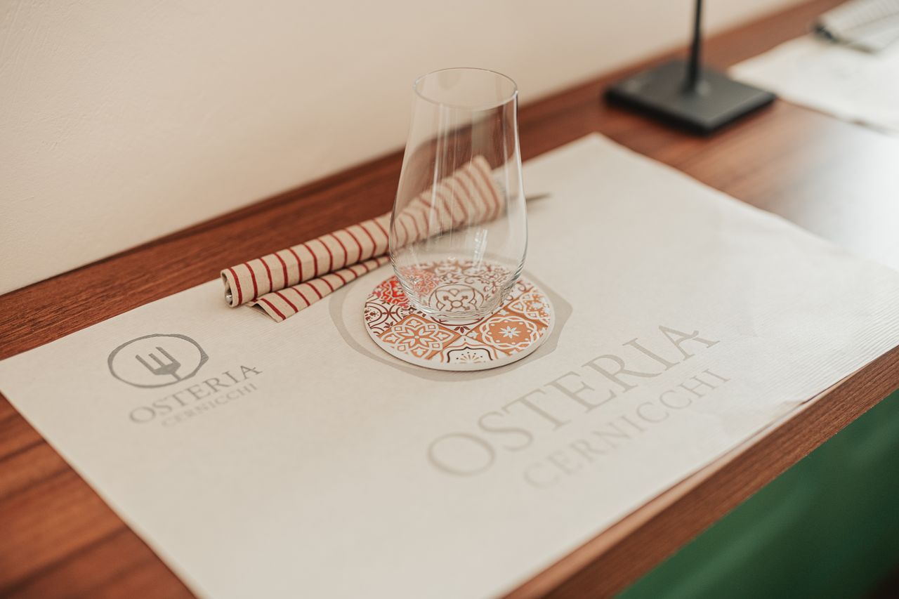A table laid with the Osteria placemat